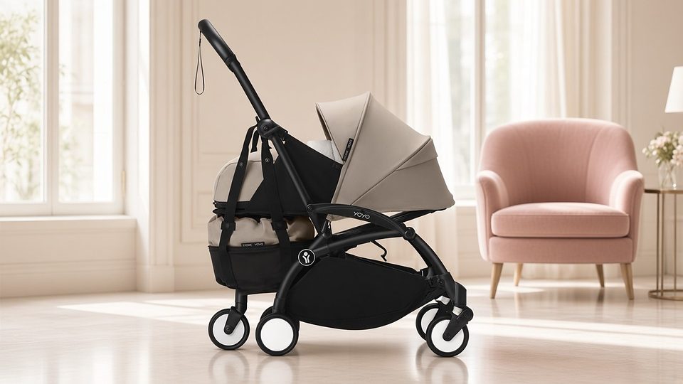 Stokke YOYO3 stroller with taupe newborn nest in a bright hotel lobby